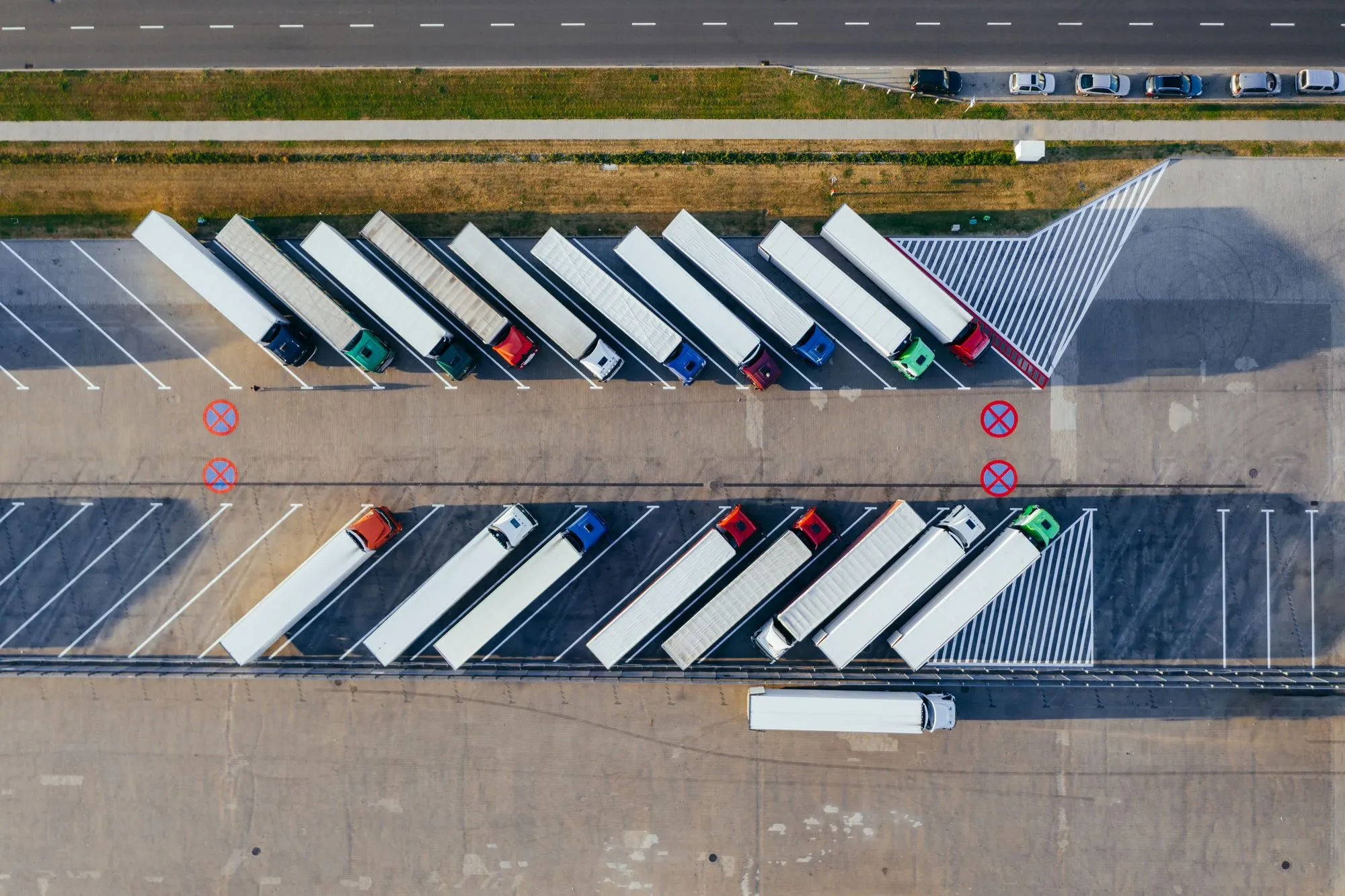 Trailers parked in marked bays across a yard, seen from above